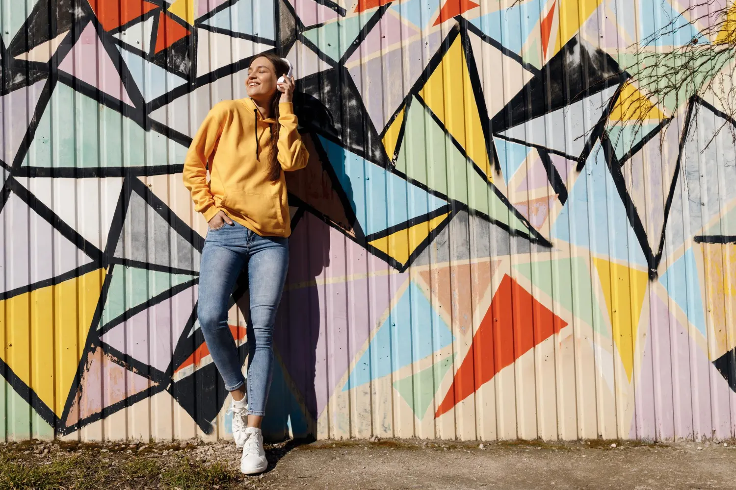 Girl standing in front of graphiti